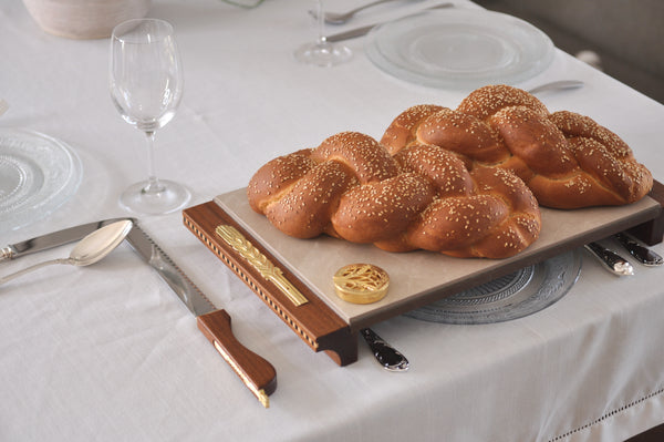 Shabbat table setting with Itzhak Luvaton's challa board