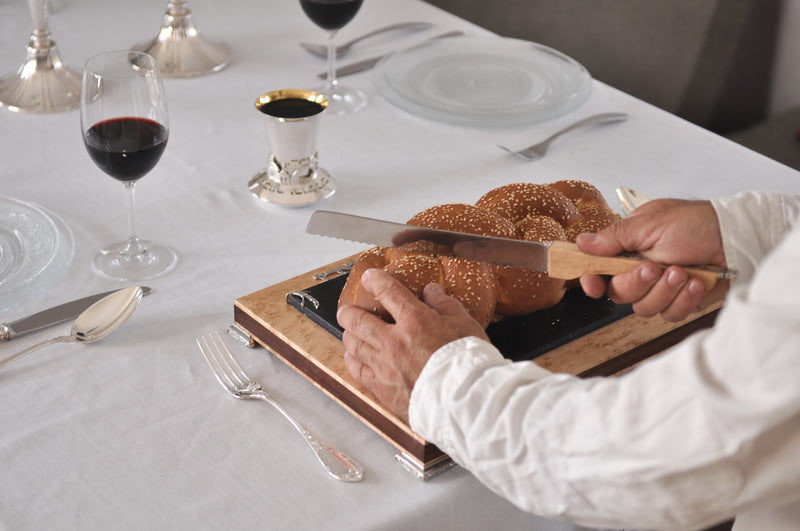 Shabbat table setting with Itzhak Luvaton's challa board